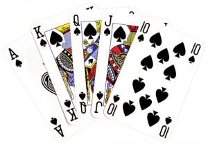 playing-cards-royal-flush-on-black-background-natalie-kinnear