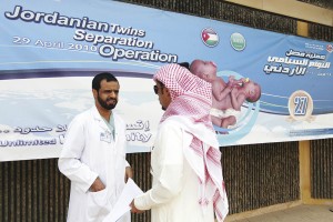 A Saudi man walks past a physician in fr